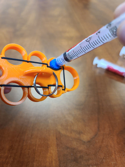 Knuckle Syringe Holder